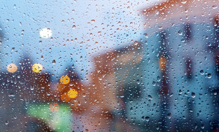 storm in the city through wet window.Home related