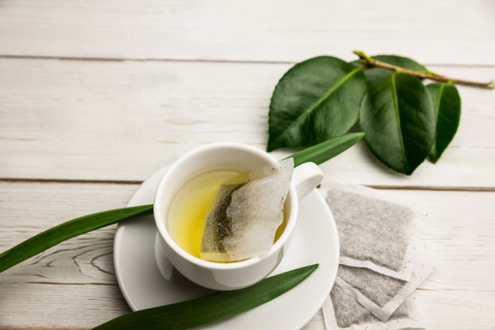 Cup of herbal tea on table shot in studio