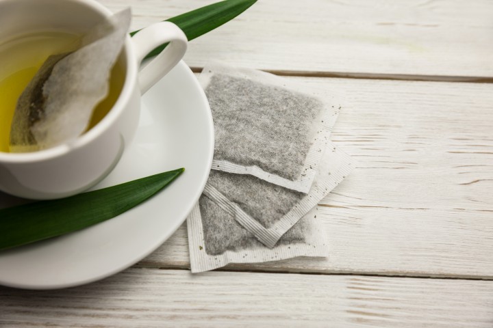Cup of herbal tea on table shot in studio