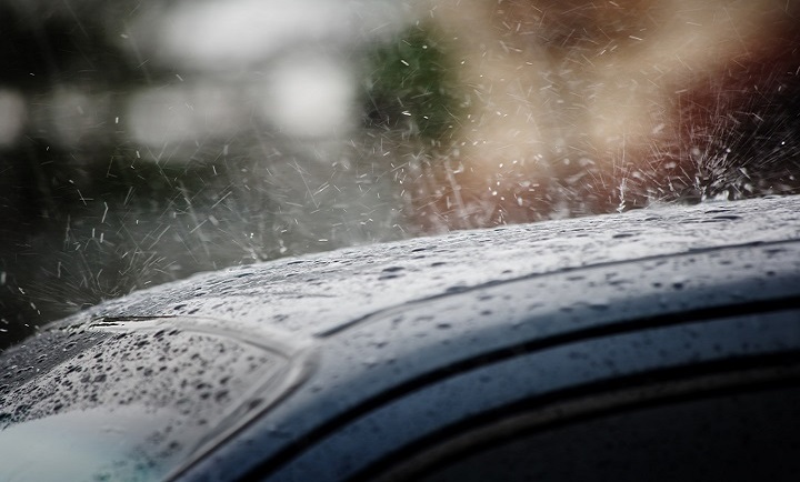 Rain on a car roof in the background in Costa Rica