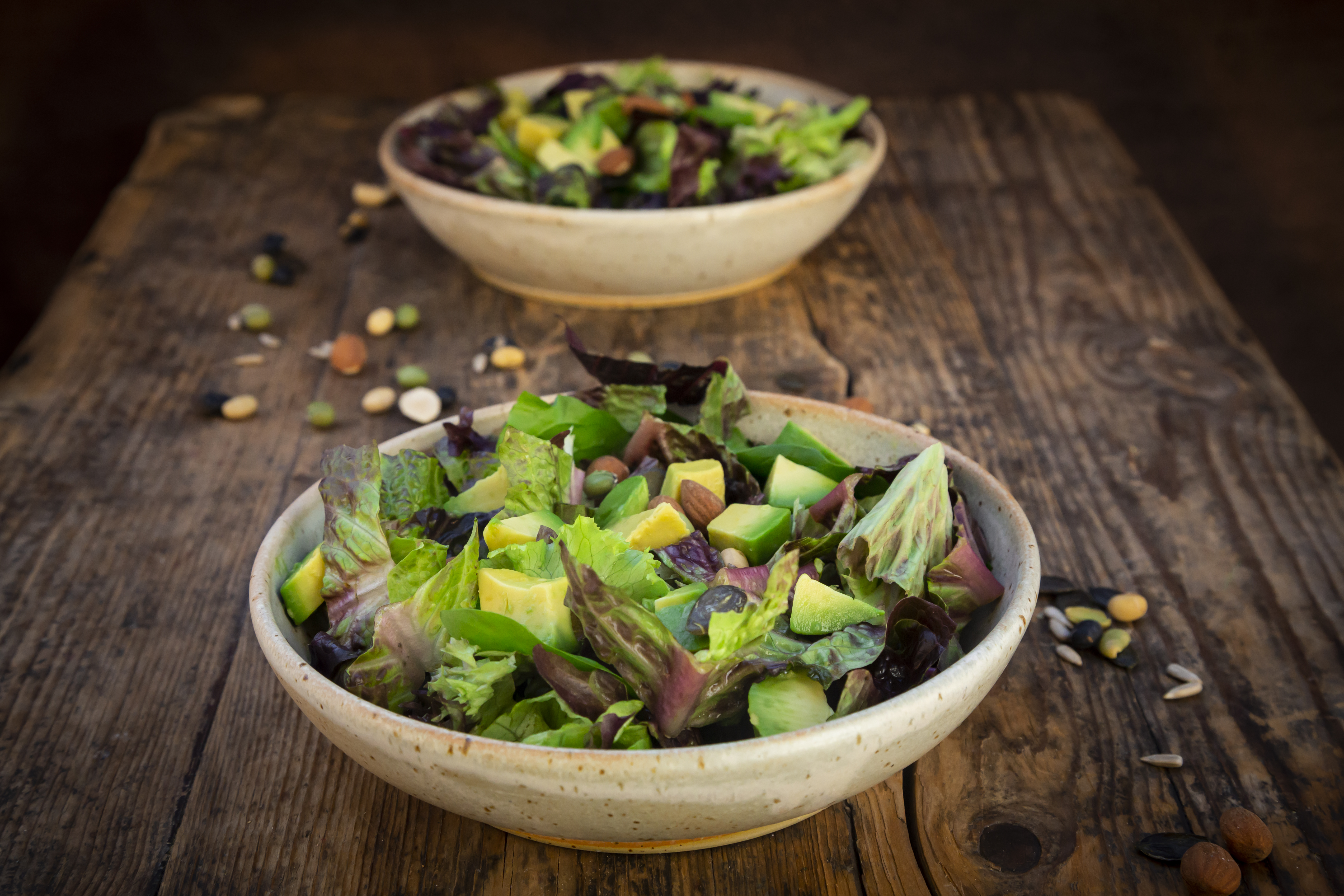 Various leaf salad with avocado, roasted seeds, almonds and soy beans