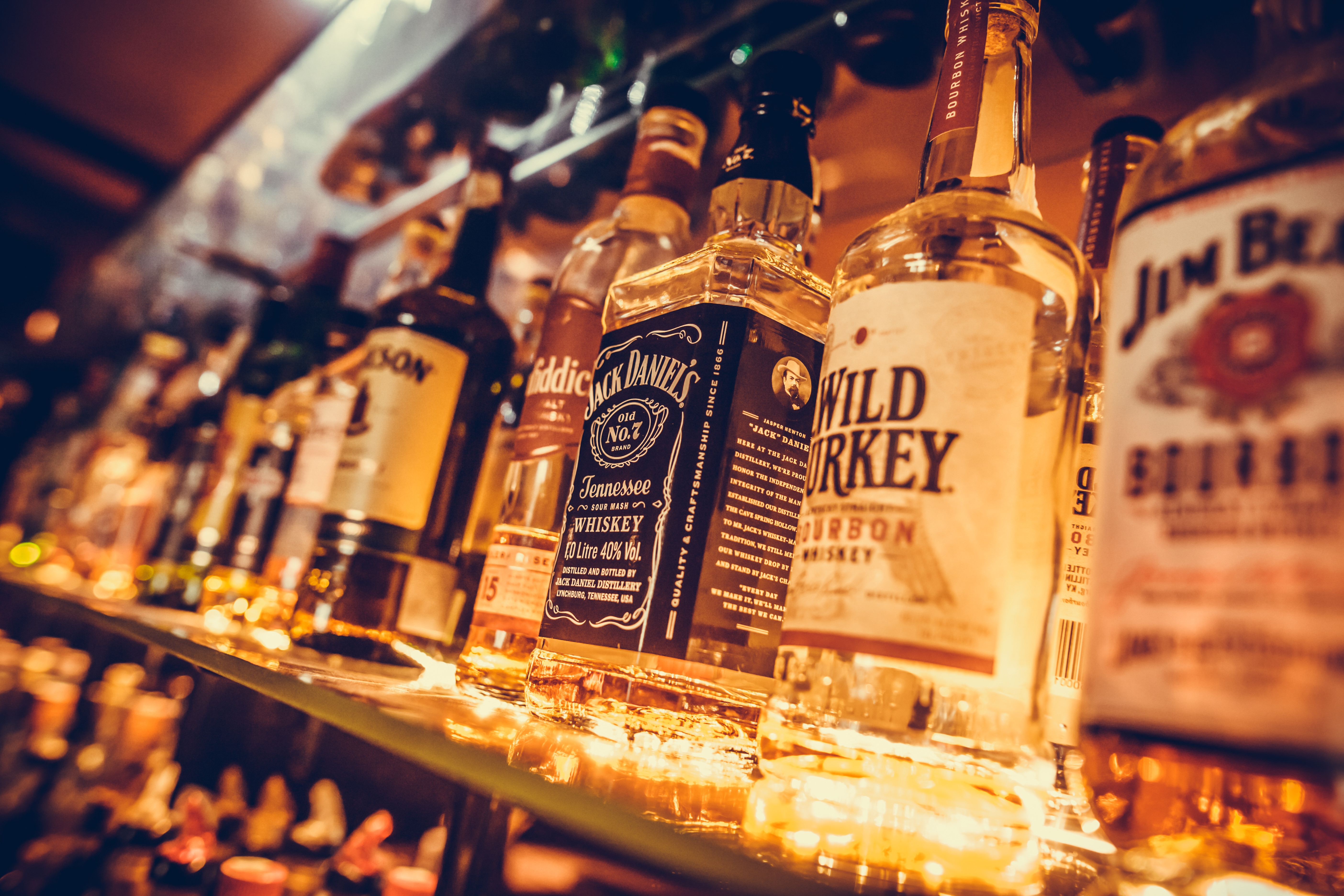 BUCHAREST, ROMANIA - March 22, 2017: Illustrative editorial image of some alcohol bottles in a row, displayed in a pub or restaurant.