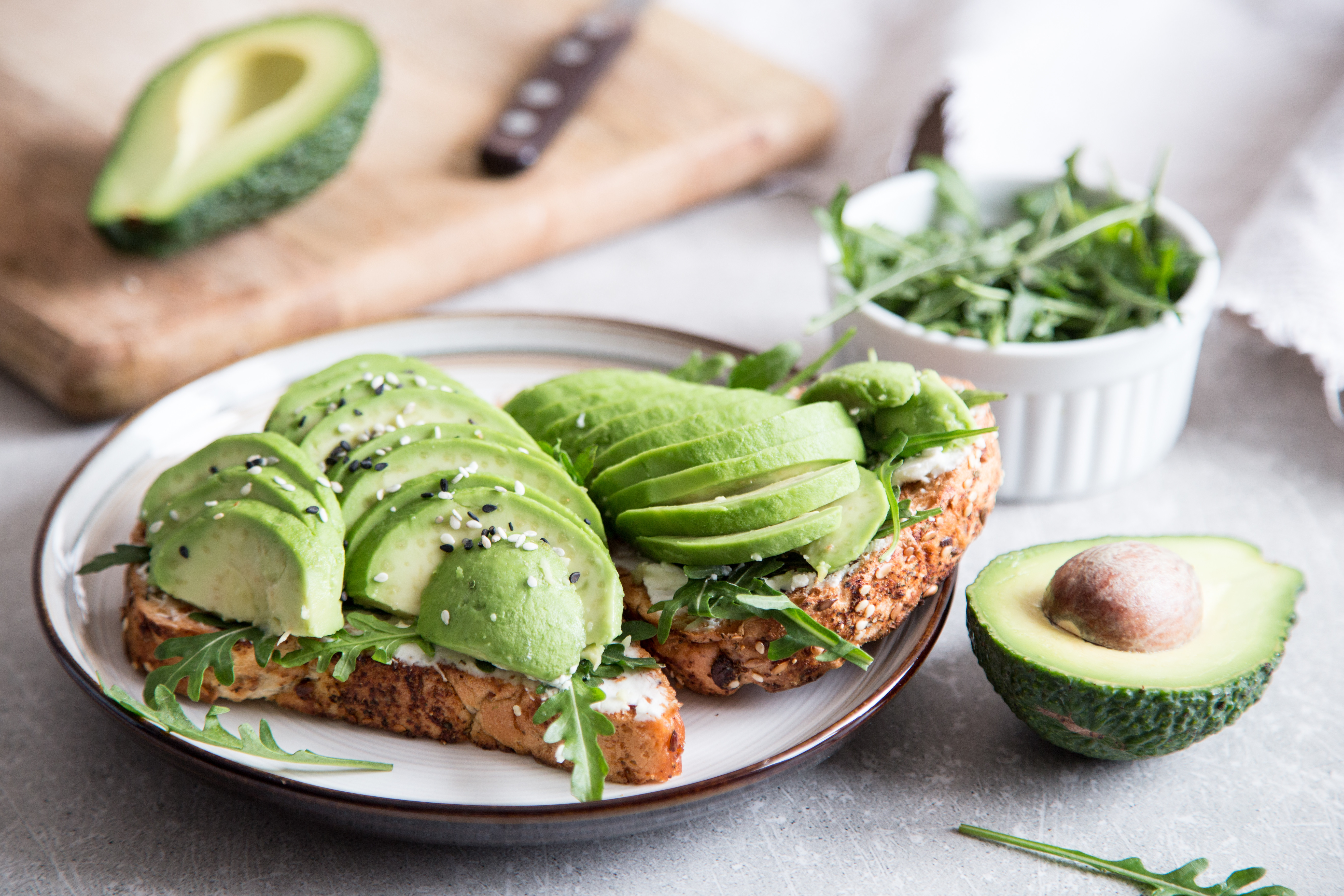 healthy breakfast with avocado and Delicious wholewheat toast. sliced avocado on toast bread with spices. Mexican cuisine/