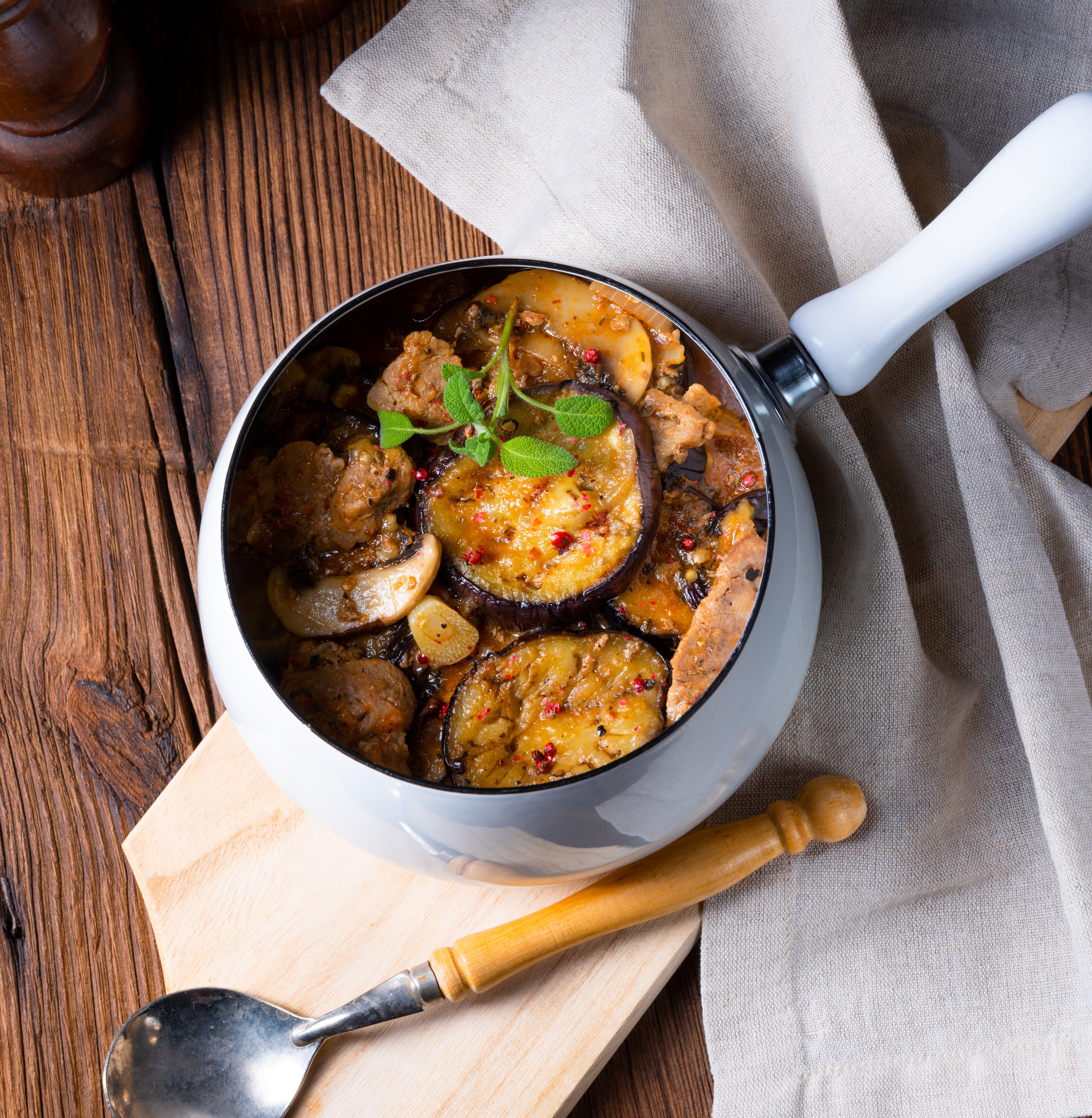 Veal goulash with baked aubergine and herbs