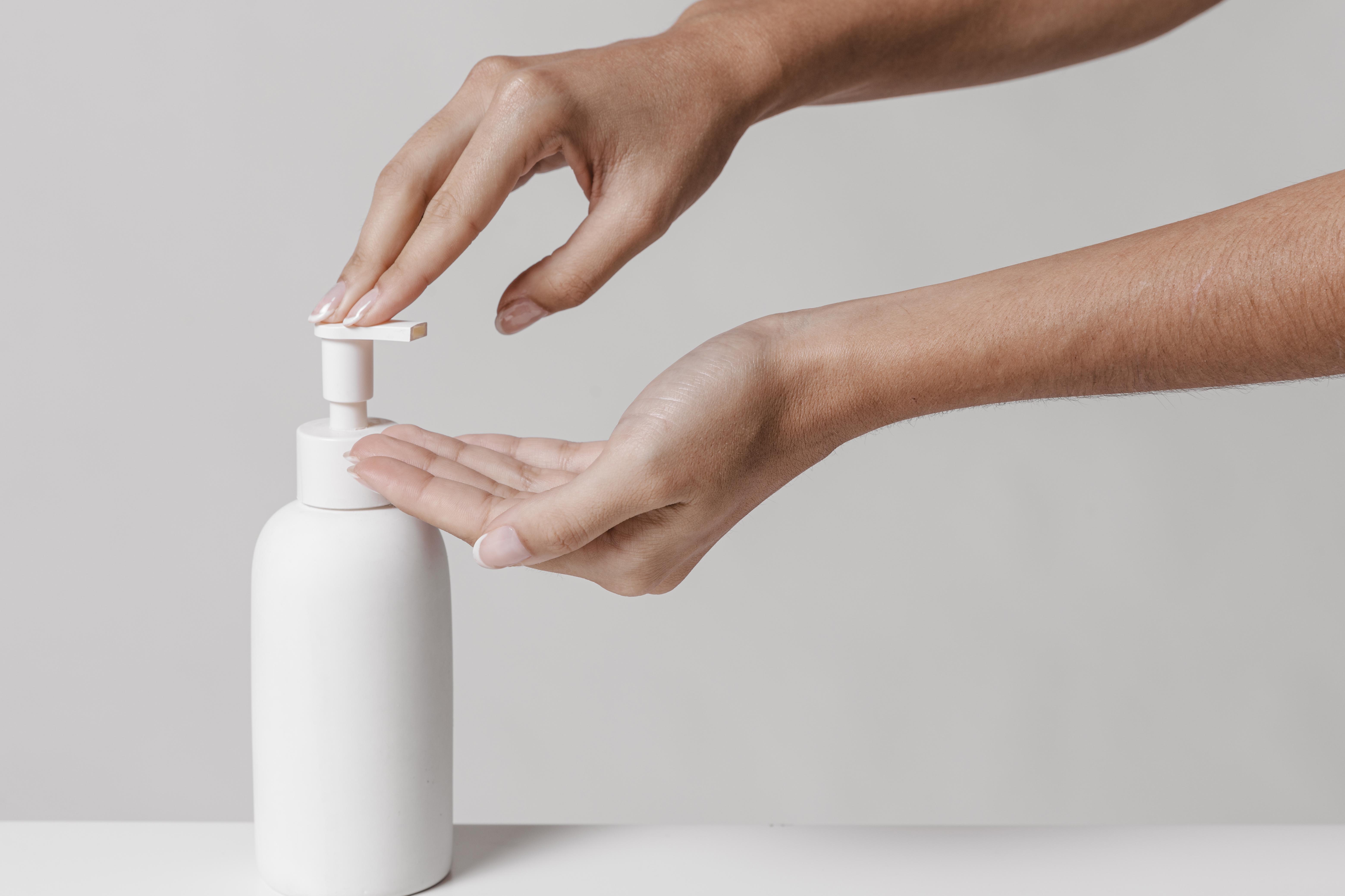 woman using liquid soap copy space. High resolution photo