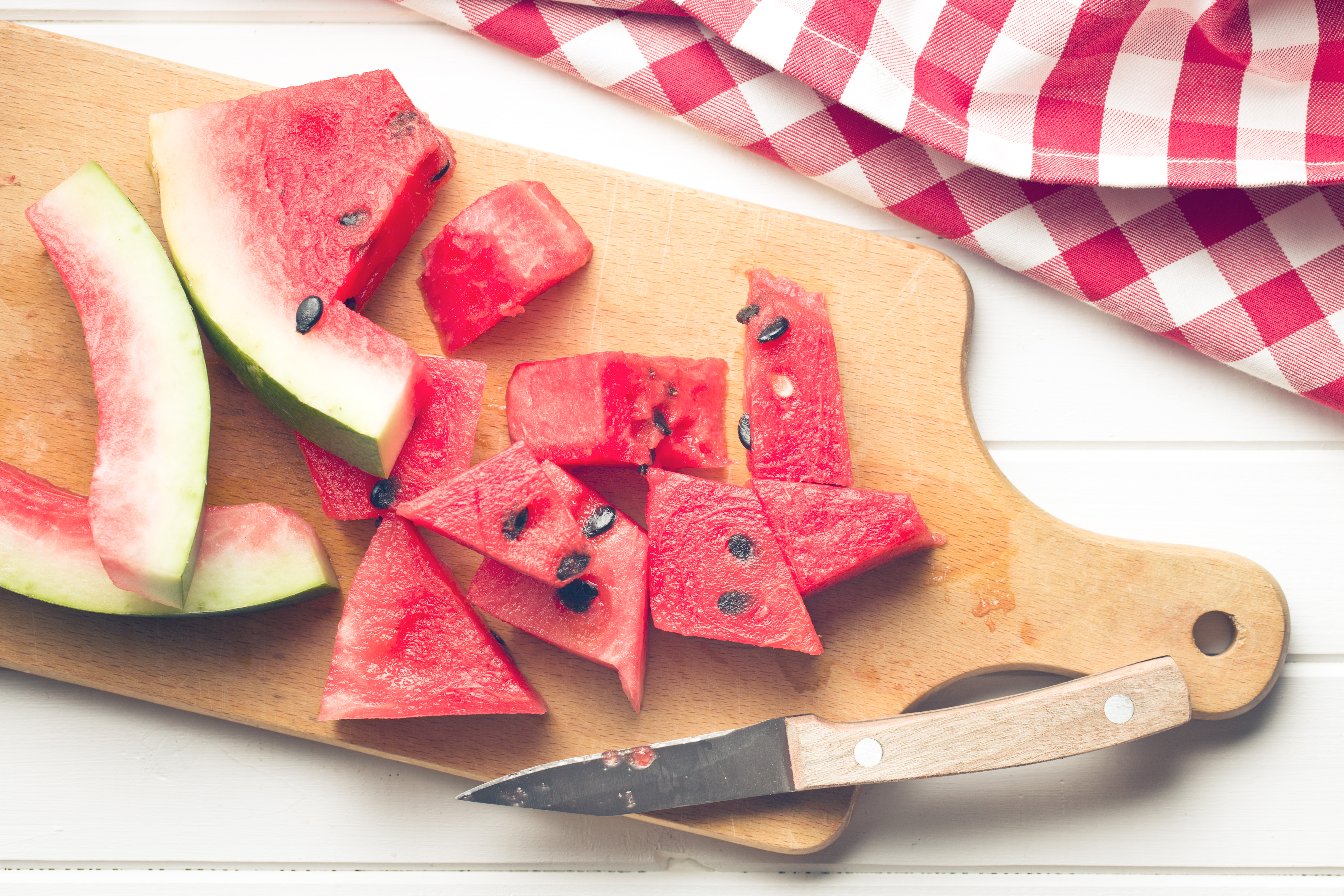 the sliced watermelon on kitchen table