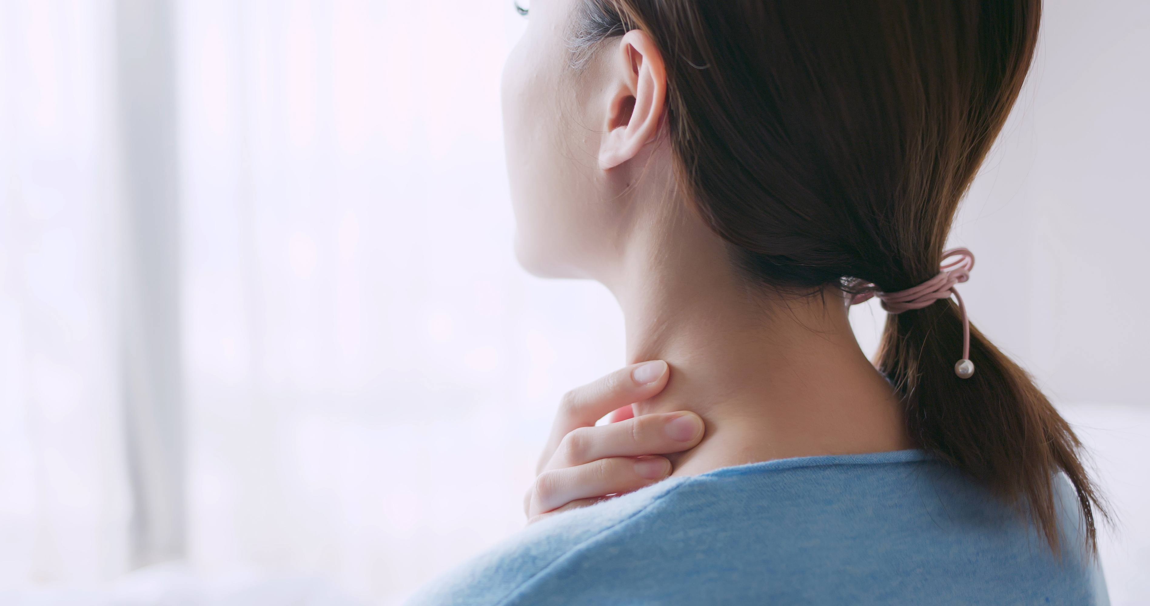 asian beauty woman has dry skin and scratching her neck