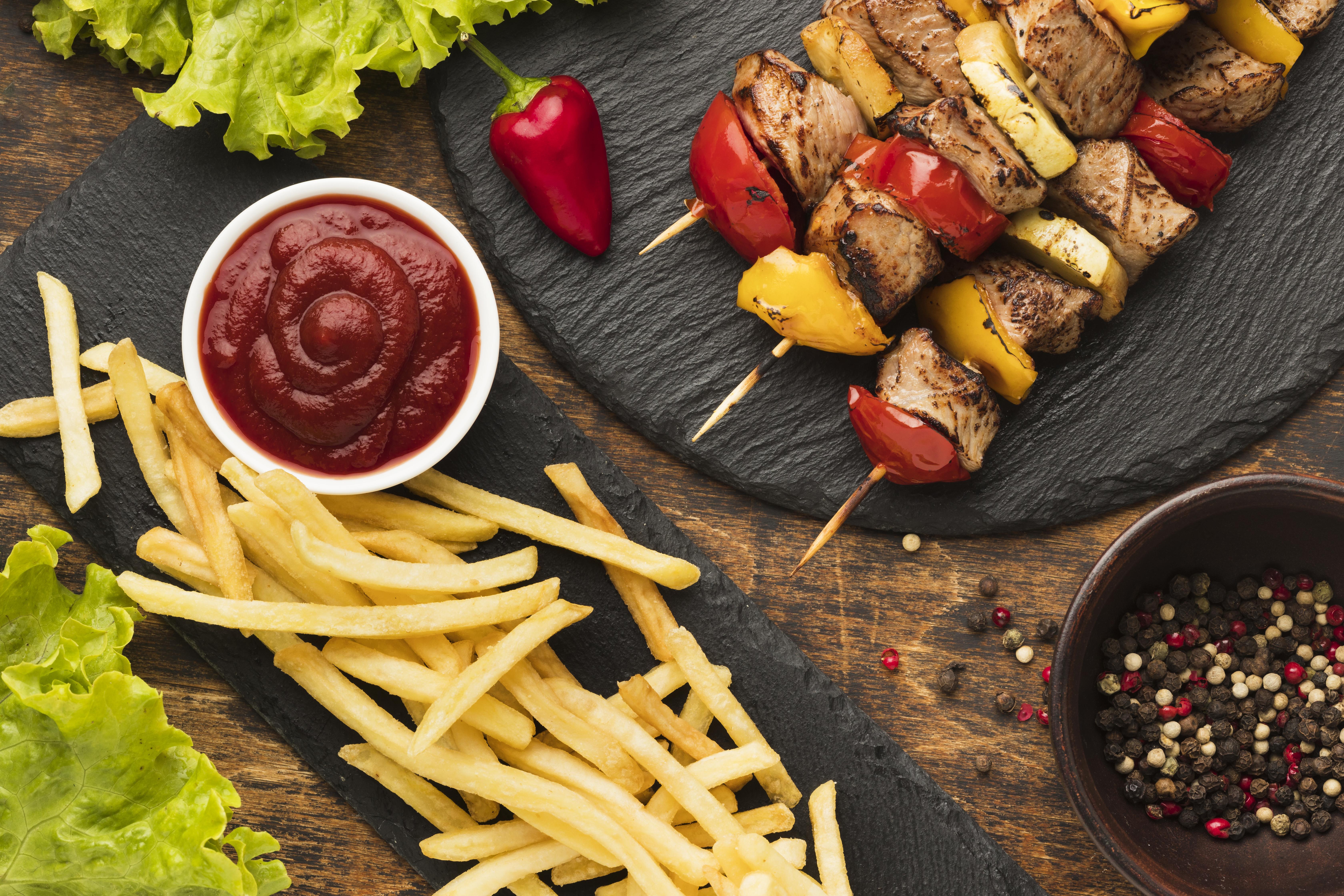 top view delicious kebab with french fries ketchup