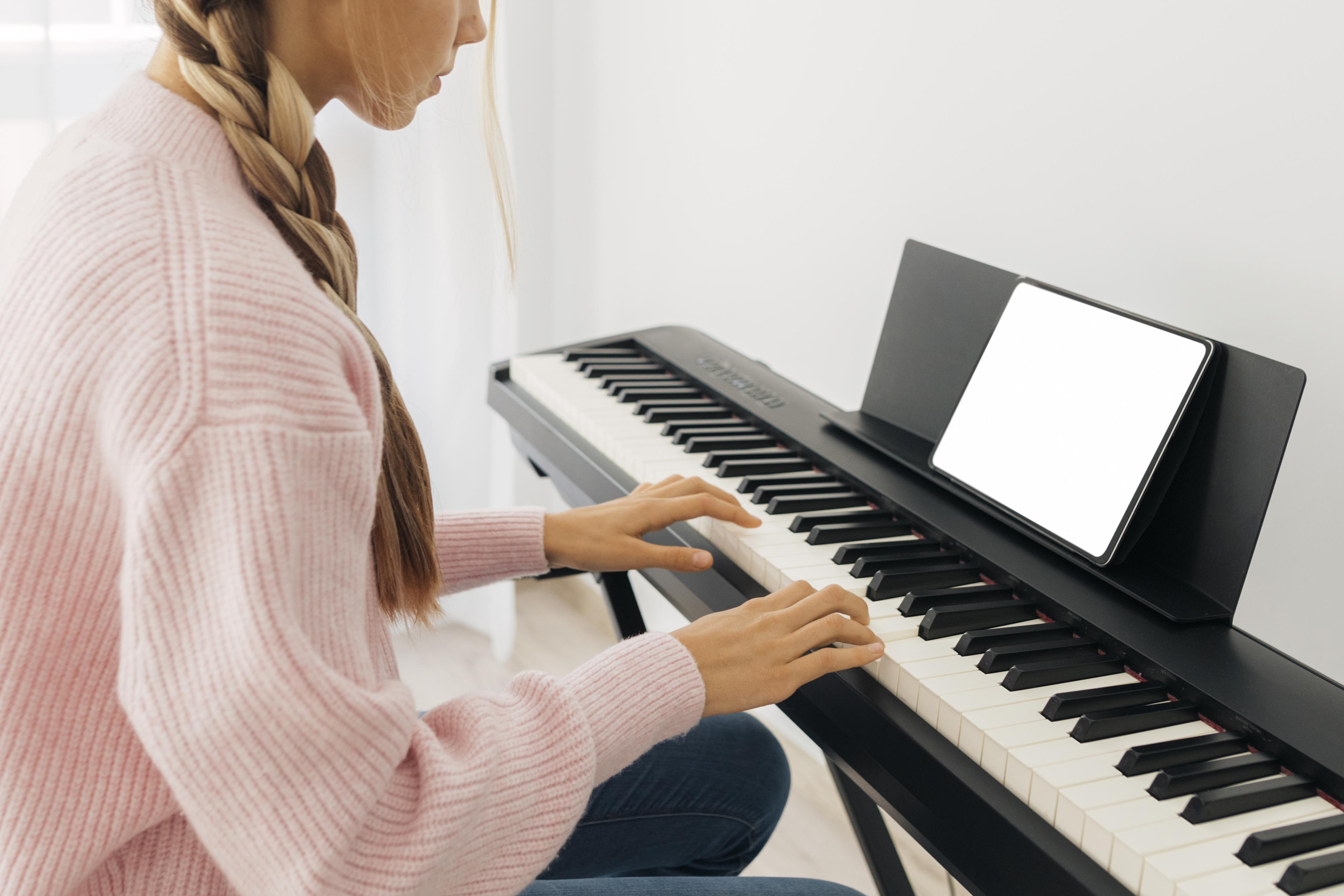 young girl playing keyboard instrument