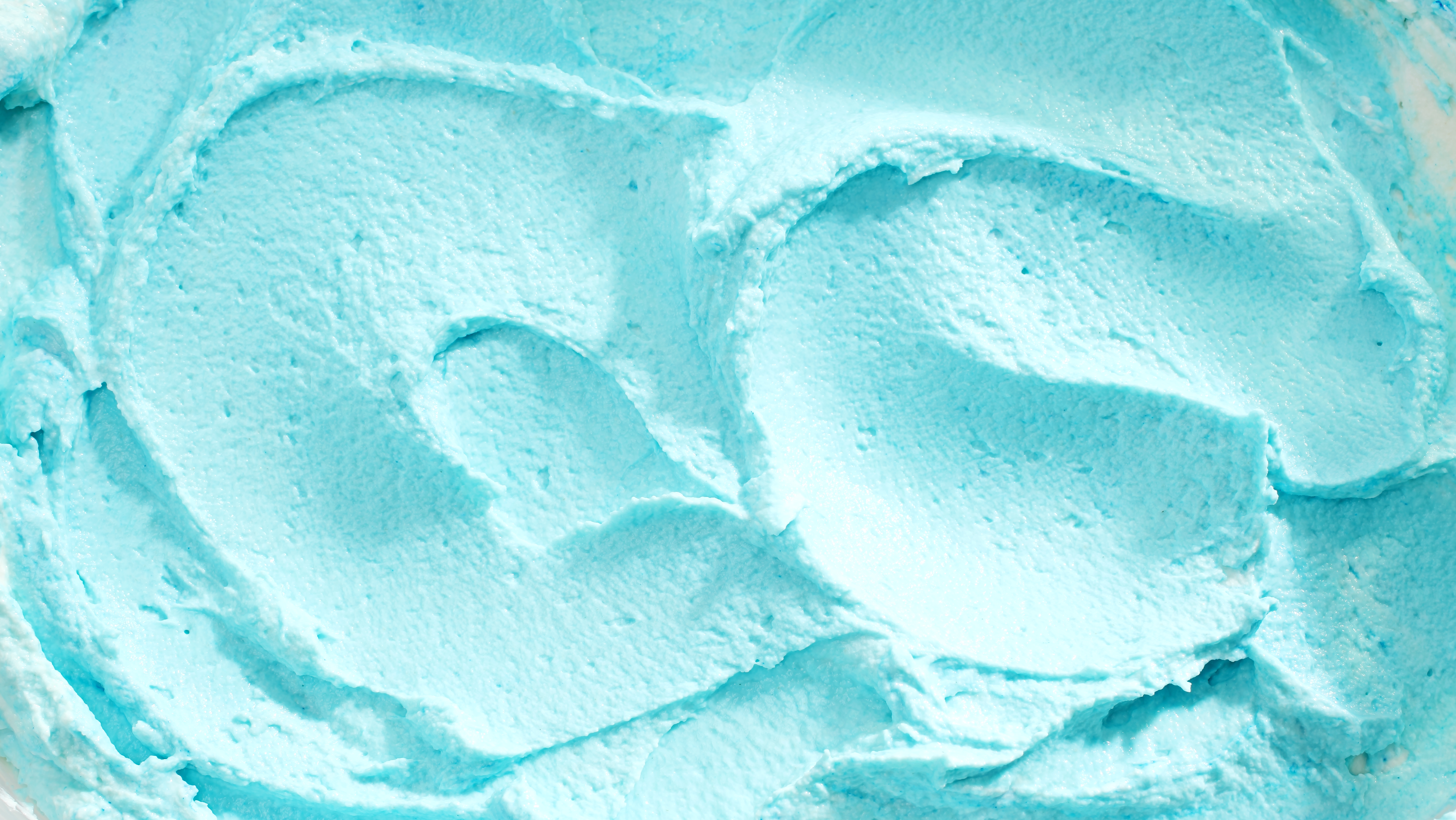 Close Up of Creamy Blue Swirled Ice Cream in Vat, Full Frame Background