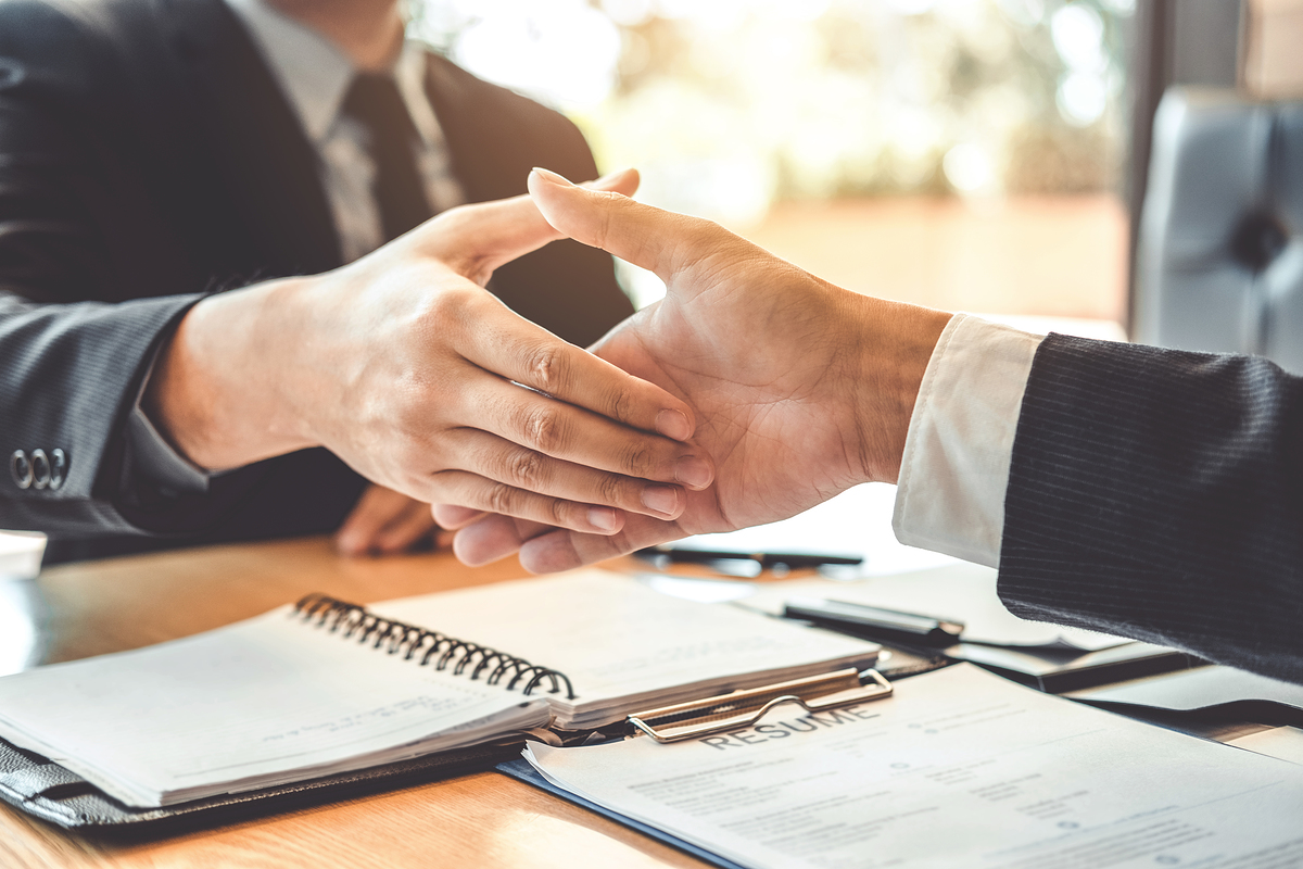 Business people greeting new colleagues while job interviewing shaking hands meeting Planning after during job interview Concept